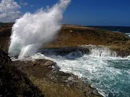 Waves crashing dramatically at Shete Boka National Park on Curaçao’s rugged north coast